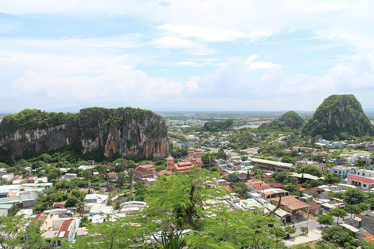The Marble Mountains (Ngu Hanh Son) rising from Da Nang's southern plain — limestone peaks with pagodas tucked into the karst