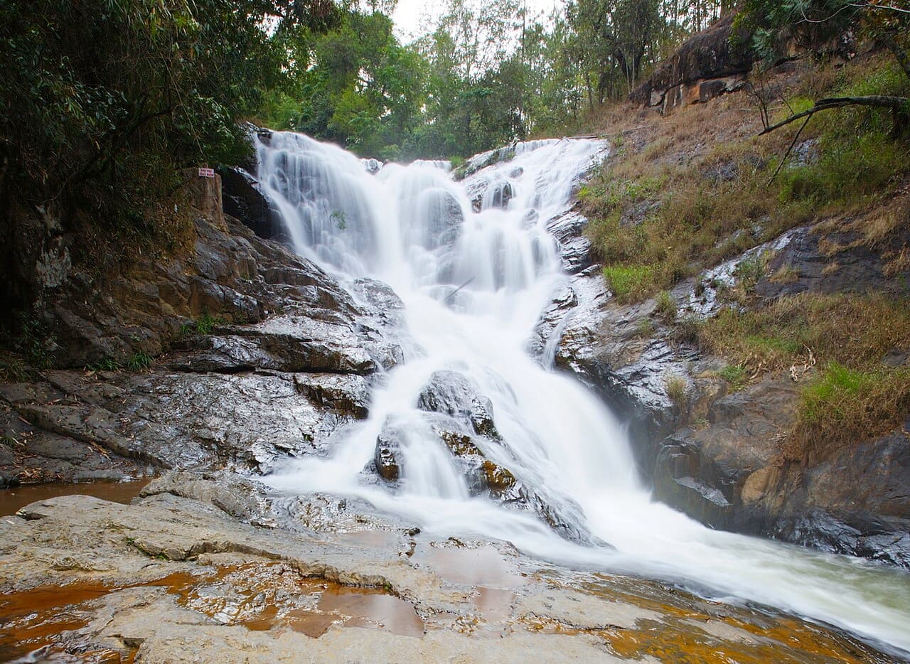 Canyoner abseiling down a waterfall in Da Lat